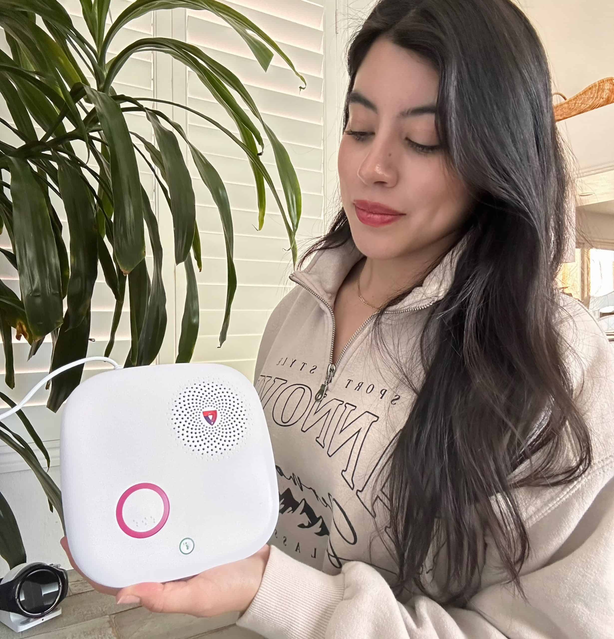 Our tester holding up the MGHome Cellular base station.
